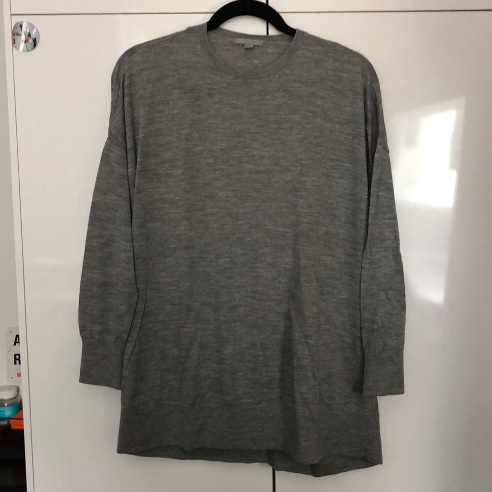 Super cute wool sweater with back knot detail!